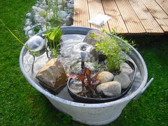 26 Genius Ideas for Repurposing Old Buckets in Your Outdoor Area